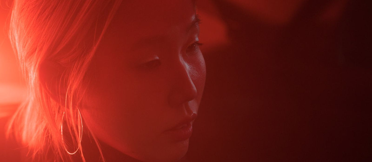 Woman illuminated by red light